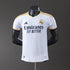Real Madrid 2425 Home Jersey displayed on a mannequin, featuring white fabric and contrasting details.